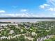 An aerial shot capturing the neighborhood nestled near a beautiful, expansive lake and scenic landscape at 6700 W Dorado Dr # 47, Littleton, CO 80123
