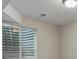 A basement bedroom featuring a window with blinds and neutral paint at 6700 W Dorado Dr # 47, Littleton, CO 80123