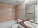 Bathroom featuring a tub with shower, toilet, and sink with mirror at 6700 W Dorado Dr # 47, Littleton, CO 80123