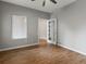 Neutral bedroom with hardwood floors, large window, and a doorway leading to another room at 6700 W Dorado Dr # 47, Littleton, CO 80123