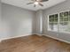 Bedroom with hardwood floors, a modern ceiling fan, and a window letting in natural light and street views at 6700 W Dorado Dr # 47, Littleton, CO 80123