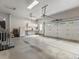 Spacious garage with ample workspace, storage cabinets, and a large door at 6700 W Dorado Dr # 47, Littleton, CO 80123