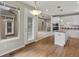 Open kitchen with island and eat in nook with a view of the living room and entry at 6700 W Dorado Dr # 47, Littleton, CO 80123