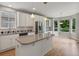 Bright kitchen with white cabinets, stainless steel appliances, and a center island at 6700 W Dorado Dr # 47, Littleton, CO 80123