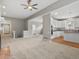 Spacious living room with lots of natural light open to the kitchen and foyer at 6700 W Dorado Dr # 47, Littleton, CO 80123