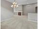 Bright living room featuring a fireplace, built-in shelves, and neutral carpet at 6700 W Dorado Dr # 47, Littleton, CO 80123
