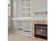 Cozy living room featuring a fireplace, a mantle and a built-in bookshelf at 6700 W Dorado Dr # 47, Littleton, CO 80123