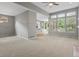 Open-concept living room with seamless transition to the kitchen, abundant natural light, and a spacious layout at 6700 W Dorado Dr # 47, Littleton, CO 80123