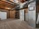 Unfinished basement featuring exposed wood and utilities, offering potential for customization at 6700 W Dorado Dr # 47, Littleton, CO 80123