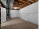 Unfinished basement featuring exposed wood and utilities, offering potential for customization at 6700 W Dorado Dr # 47, Littleton, CO 80123