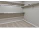 Walk-in closet with built-in shelving and carpeted flooring, providing ample storage and organization space at 6700 W Dorado Dr # 47, Littleton, CO 80123