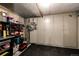 Basement storage area with multiple storage closets, dark tile floor, and shelving units at 780 N Franklin St, Denver, CO 80218