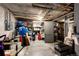Unfinished basement offers ample storage with open ceiling, concrete floor, and utility connections at 780 N Franklin St, Denver, CO 80218