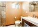 Bathroom features neutral tile walls, toilet and a modern vanity with a vessel sink at 780 N Franklin St, Denver, CO 80218