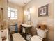 Neutral bathroom with a towel warmer and pedestal sink at 780 N Franklin St, Denver, CO 80218
