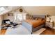 Stylish bedroom features hardwood floors, a bay window, and a modern upholstered bed frame at 780 N Franklin St, Denver, CO 80218