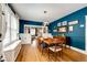 An elegant dining room featuring a wooden table, hardwood floors, and blue walls at 780 N Franklin St, Denver, CO 80218