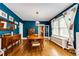 An elegant dining room featuring a wooden table, hardwood floors, and blue walls at 780 N Franklin St, Denver, CO 80218
