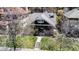 Charming home with landscaped front yard, stone porch columns, and prominent street-facing address at 780 N Franklin St, Denver, CO 80218
