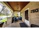 Charming front porch with comfortable seating, perfect for enjoying a peaceful outdoor moment at 780 N Franklin St, Denver, CO 80218