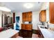 A bright kitchen features wooden cabinets, stainless steel appliances, and dark hardwood floors at 780 N Franklin St, Denver, CO 80218