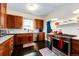 A bright kitchen features wooden cabinets, stainless steel appliances, and dark hardwood floors at 780 N Franklin St, Denver, CO 80218