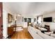Open-concept living room featuring hardwood floors, a fireplace, and a cozy seating area at 780 N Franklin St, Denver, CO 80218