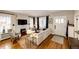 Bright living room featuring hardwood floors, fireplace, and ample natural light at 780 N Franklin St, Denver, CO 80218