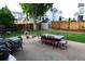 Inviting backyard with a patio set, shed, swing, and fenced yard, perfect for outdoor entertaining and relaxation at 1936 S Poplar St, Denver, CO 80224
