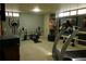 Basement with workout equipment including a treadmill and weight bench at 1936 S Poplar St, Denver, CO 80224