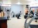 Basement gym area, complete with a treadmill and weightlifting equipment at 1936 S Poplar St, Denver, CO 80224