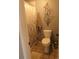 Neutral bathroom featuring a decorative wall hanging and a shower with a patterned curtain at 1936 S Poplar St, Denver, CO 80224