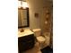 Bathroom featuring a vanity, toilet and shower with black hardware at 1936 S Poplar St, Denver, CO 80224