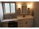 Bright bathroom with a vanity, modern fixtures, and vanity area at 1936 S Poplar St, Denver, CO 80224