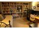 Bedroom showcasing a bed, bookshelf and a desk with a comfortable chair for relaxing at 1936 S Poplar St, Denver, CO 80224