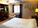 Comfortable bedroom with an armchair, closet space, a ceiling fan, and natural light at 1936 S Poplar St, Denver, CO 80224