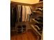 Organized walk-in closet with hanging space, shelving, and shoe racks at 1936 S Poplar St, Denver, CO 80224