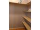 Walk in closet with a lot of storage shelving for shoes and clothes at 1936 S Poplar St, Denver, CO 80224