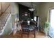 Cozy dining room with hardwood floors, staircase, and stylish decor at 1936 S Poplar St, Denver, CO 80224