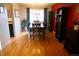 Cozy dining room featuring hardwood floors, a chandelier, and a bright window at 1936 S Poplar St, Denver, CO 80224
