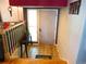 Inviting entryway with tile floors, modern decor, and stairs leading to upper level at 1936 S Poplar St, Denver, CO 80224