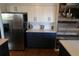 Updated kitchen featuring stainless steel appliances, white cabinets, and stylish decor at 1936 S Poplar St, Denver, CO 80224