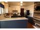 Modern kitchen with white cabinets, stainless steel appliances, and beautiful countertops at 1936 S Poplar St, Denver, CO 80224