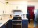 Modern kitchen with stainless steel appliances, stylish cabinets, and a spacious layout at 1936 S Poplar St, Denver, CO 80224