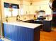 Modern kitchen featuring two-toned cabinets, stainless steel appliances, and quartz countertops at 1936 S Poplar St, Denver, CO 80224