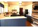 Modern kitchen featuring two-toned cabinets, stainless steel appliances, and quartz countertops at 1936 S Poplar St, Denver, CO 80224
