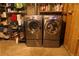 Laundry room featuring a modern side-by-side washer and dryer at 1936 S Poplar St, Denver, CO 80224