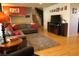 Bright living room with hardwood floors and modern decor and a staircase leading to the second floor at 1936 S Poplar St, Denver, CO 80224