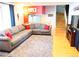 Spacious living room with hardwood floors, a comfortable sectional, and natural light at 1936 S Poplar St, Denver, CO 80224