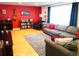 Cozy living room featuring hardwood floors, a plush sofa, and stylish decor at 1936 S Poplar St, Denver, CO 80224